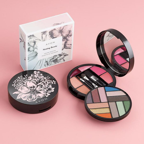 Open compact of Nesting Beauty Color Palette, next to the empty packaging and a second closed compact, against a pink background