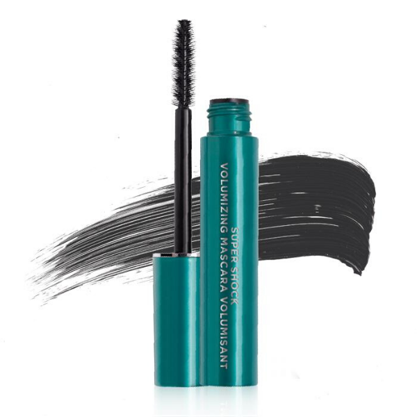Open tube of Super Shock Volumizing mascara in front of an artistic mascara smear, against a white background