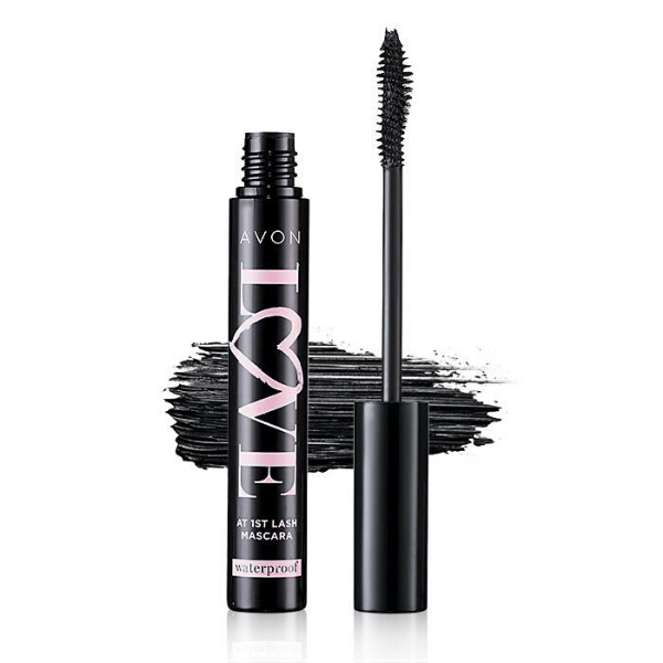 Open tube of Love at 1st Lash Waterproof Mascara in front of an artistic mascara smear, against a white background