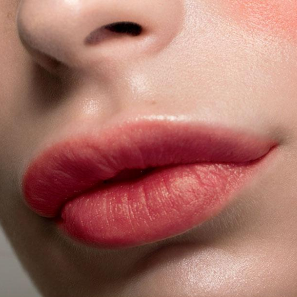 Close up of a woman's lips showing the VDL Creamy Stick Jelly in the shade riding hood