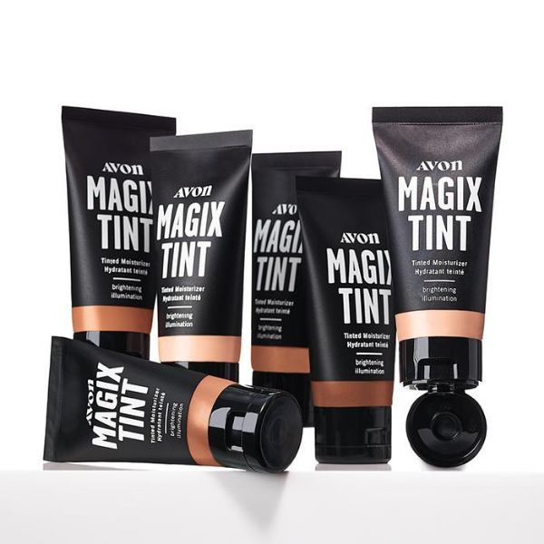 Six bottles of MagiX Tint Tinted Moisturizer, an Avon vegan makeup product, against a light grey background