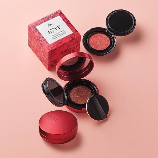 Open package of the True Love Cushion Blush & Highlighter duo, against a peach pink background