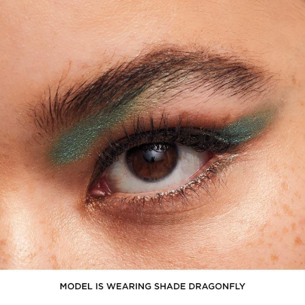Close up of a woman's eye wearing vibrant green gel eyeshadow