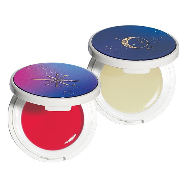 Two open containers of REACH Pop-Up Lip Balm, against a white background