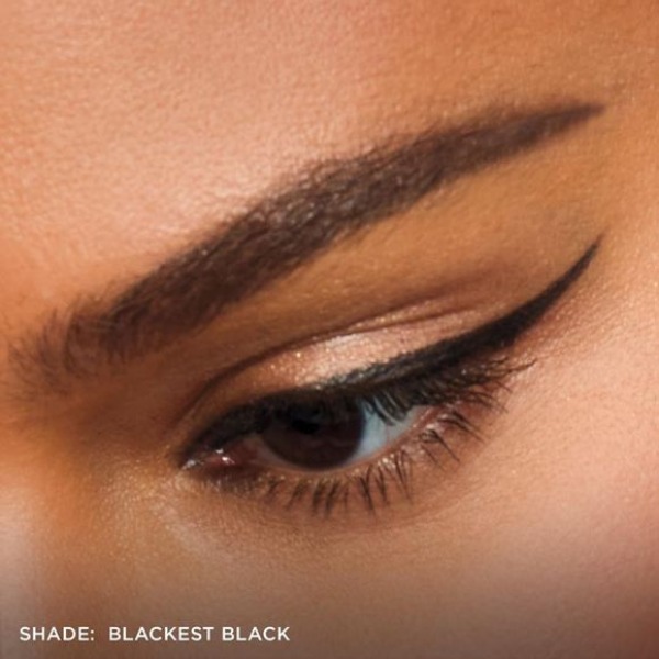 Close up of a woman's eye with thin winged eyeliner, showing off the fmg Glimmer Liquid Eyeliner