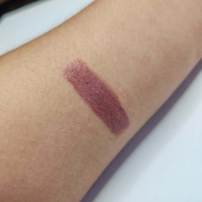 Arm swatch showing the shade Morning Glory in Avon's Glimmer Satin Lipstick