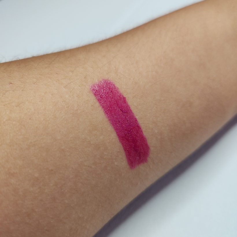 Arm swatch showing the shade Tulip in Avon's Glimmer Satin Lipstick