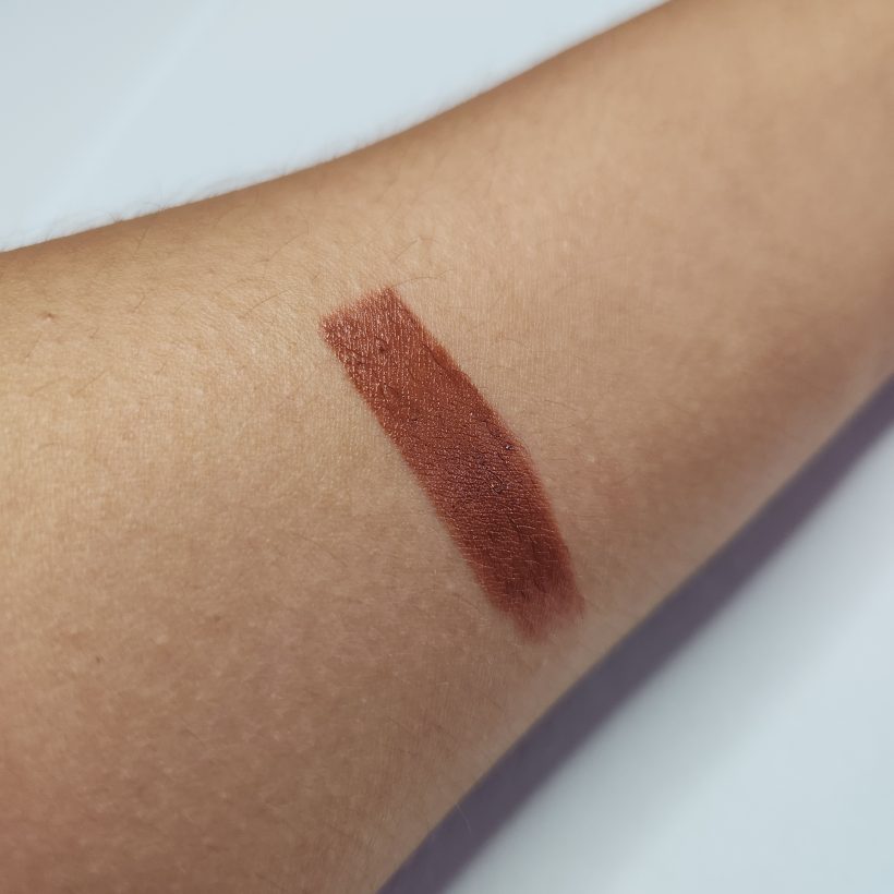 Arm swatch showing the shade Twilight in Avon's Glimmer Satin Lipstick