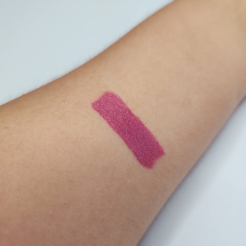 Arm swatch showing the shade Wildrose in Avon's Glimmer Satin Lipstick