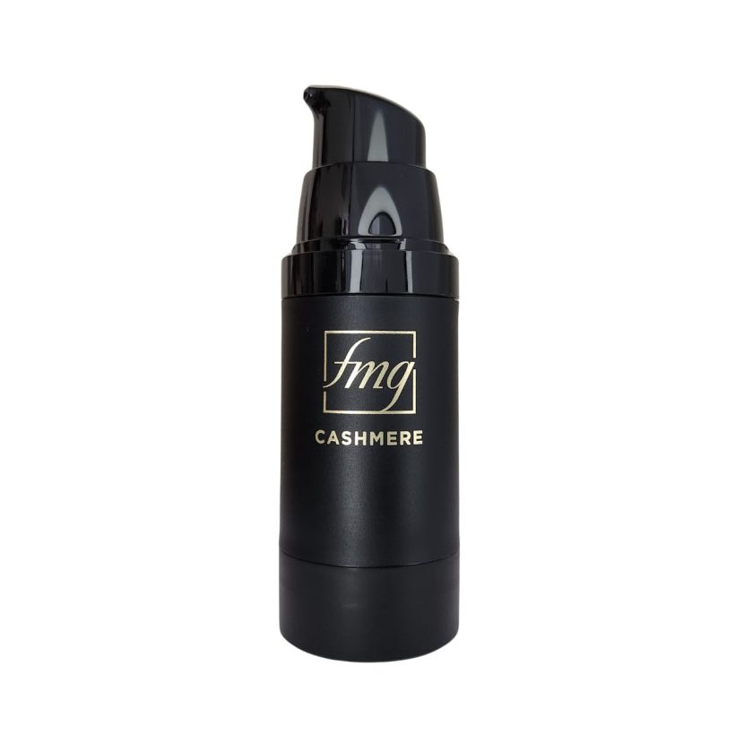Open makeup primer bottle that is black with gold writing that reads "fmg" and "Cashmere", against a white background