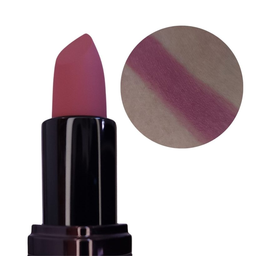 Open tube of mauve lipstick with only the top half showing, next to a arm swatch of the same shade