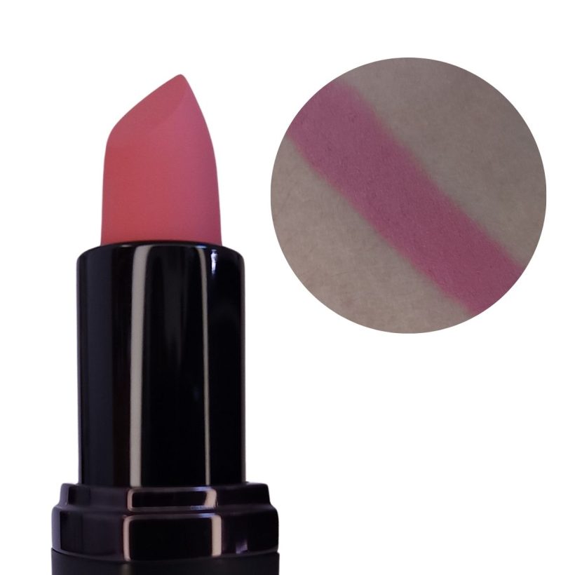 Open tube of muted pink lipstick with only the top half showing, next to a arm swatch of the same shade