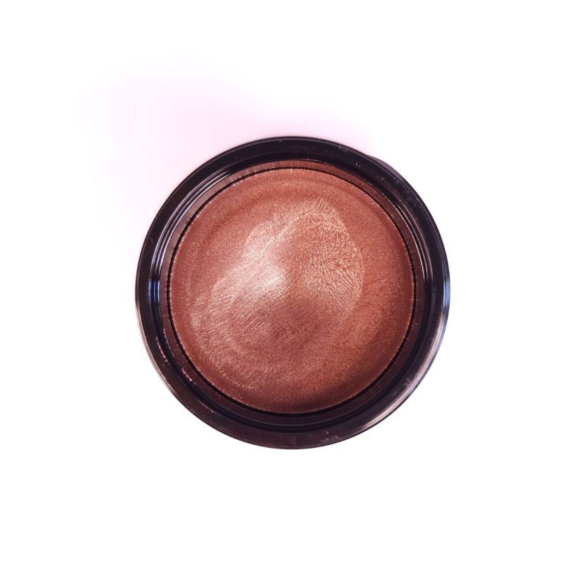 Open tub of Cashmere Multi-Balm in the shade Beach Blush, against a white background