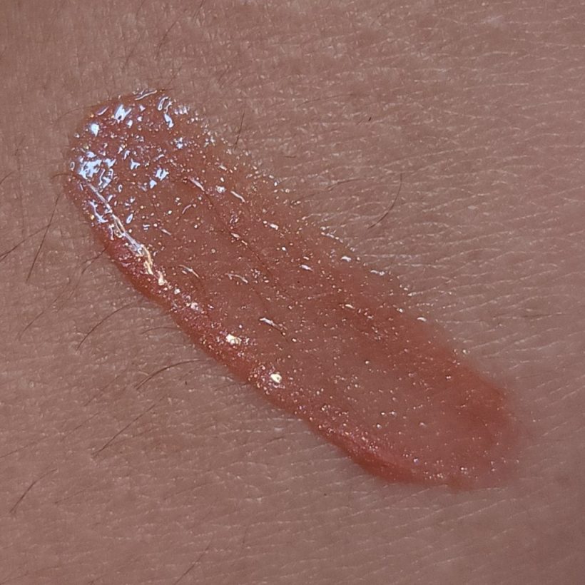 Arm swatch showing Glimmer Lip Gloss in the shade Copperlight