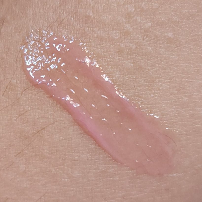 Arm swatch showing Glimmer Lip Gloss in the shade Sugar Sweet